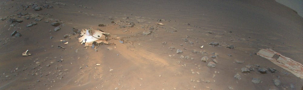 PIA25218: Debris Field for Perseverance Landing Gear Seen from Mars Helicopter. This image of Perseverance's backshell (left of center), supersonic parachute (far right), was collected from an altitude of 26 feet (8 meters) by NASA's Ingenuity Mars Helicopter during its 26th flight on Mars on April 19, 02022. During the Feb. 18, 02021 landing of Perseverance, the parachute and backshell were jettisoned at about 1.3 miles (2.1 km) altitude. The parachute and backshell continued to descend and impacted the ground at approximately 78 mph (126 kph). 

Image Credit: NASA/JPL-Caltech - https://photojournal.jpl.nasa.gov/jpeg/PIA25218.jpg