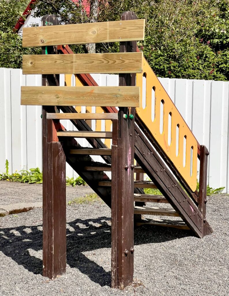 Steps up to a missing children's slide.