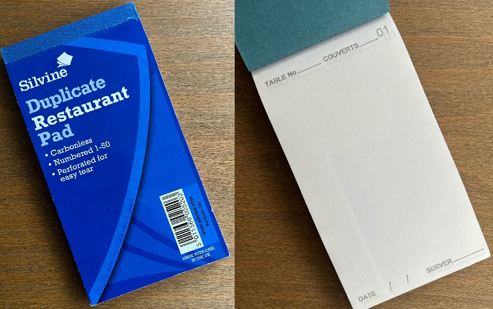 Notepads used by waiters and waitresses to make a copy of what is written onto two sheets