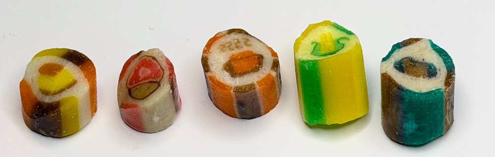 5 pieces of candy from Lofty Pursuits, the first has a small image of a yam, the second is ham, the third is pumpkin pie, the fourth is sweet butter corn and the fifth is stuffing
