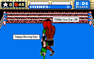 Screenshot from the old Nintendo game Punch Out of Little Mac saying Happy Boxing Day and Mike Tyson saying I'll bite your ear off