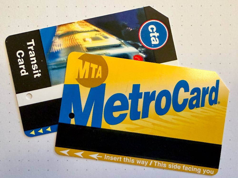 Photo of an NYC metro card and a Chicago CTA card.