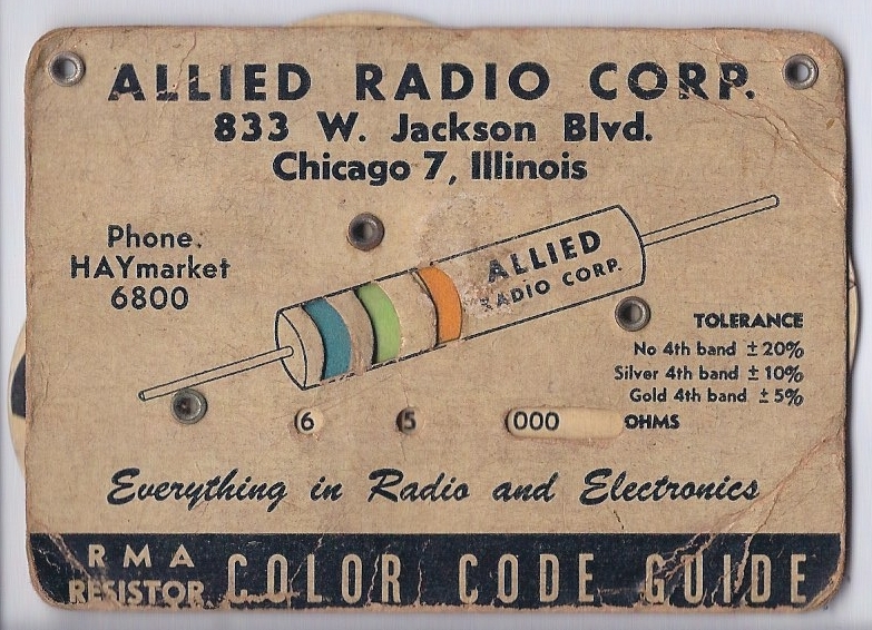 A photo of a business card with 3 turnable wheels. These wheels adjusted the color of the resister band through a small cutout on the card.