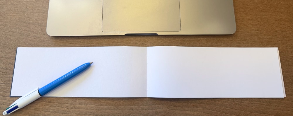 Photo of a Quarter Notebook underneath a keyboard